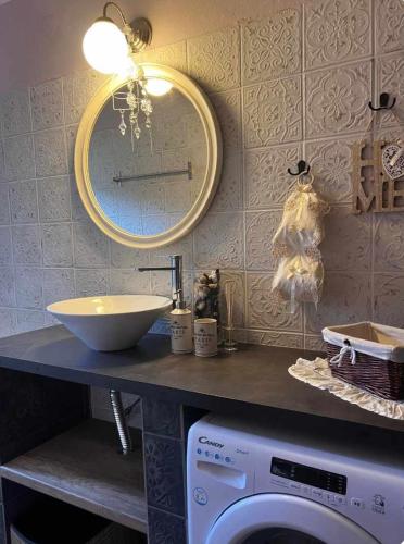 a bathroom with a sink and a washing machine at Luxury suites in Villa Anasia, Olympia in Skotina