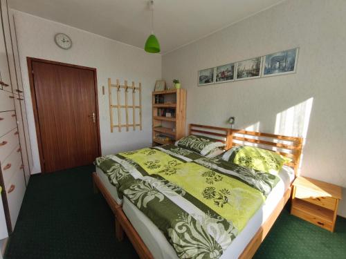 Postel nebo postele na pokoji v ubytování Green Room