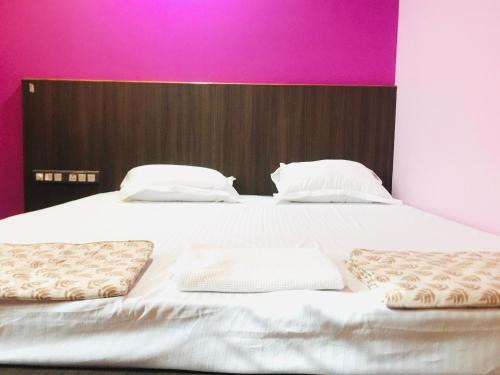 Postel nebo postele na pokoji v ubytování Chanda Palace Guest House