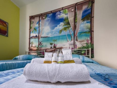 a bedroom with a mural of a beach at San Paolo Hospital 2mins - HiperWifi - SmartTV - AC in Savona