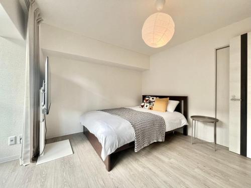 Ένα ή περισσότερα κρεβάτια σε δωμάτιο στο Shinjuku 1001