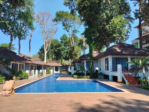 a swimming pool in front of a house at Chang Buri Resort & Koh Chang Hillside in Ko Chang
