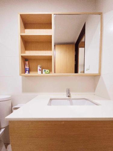 a bathroom with a sink and a mirror at The Feeltrue phuket ck in Ban Klang