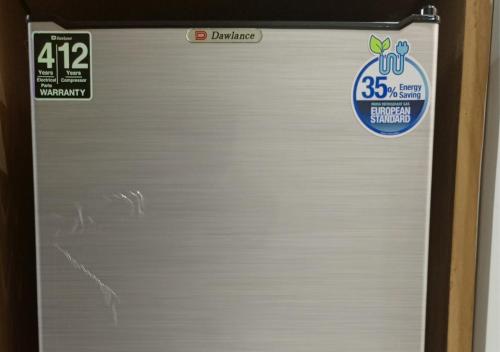 a refrigerator door with a sticker on it at Leading Continental Hotel - Muzaffarabad AJK in Muzaffarabad