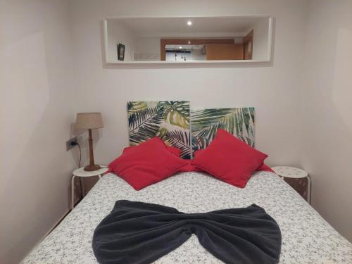 Giường trong phòng chung tại Duplex con encanto en casco viejo junto al puerto