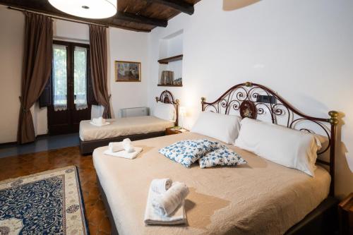 Katil atau katil-katil dalam bilik di Agriturismo Costantino
