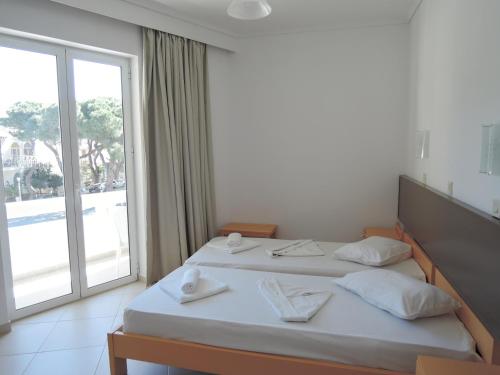 Postel nebo postele na pokoji v ubytování Fantasia Hotel Apartments