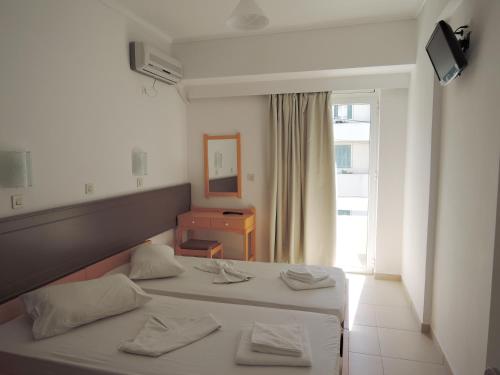 Postel nebo postele na pokoji v ubytování Fantasia Hotel Apartments