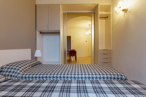 a bedroom with a large bed and a table at Residence Al Granzo in Trieste
