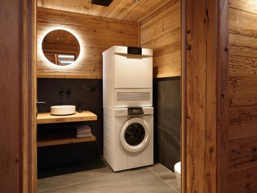 a washer and dryer in a bathroom at My Chalet in Meiringen