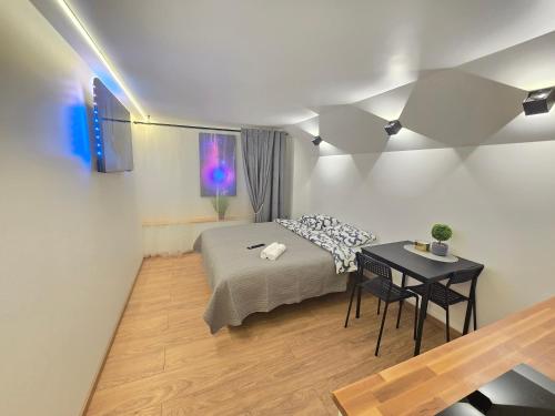 Postel nebo postele na pokoji v ubytování T5 Studio apartment