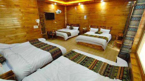 Postel nebo postele na pokoji v ubytování Homestay Tuấn Hưng Mèo Vạc
