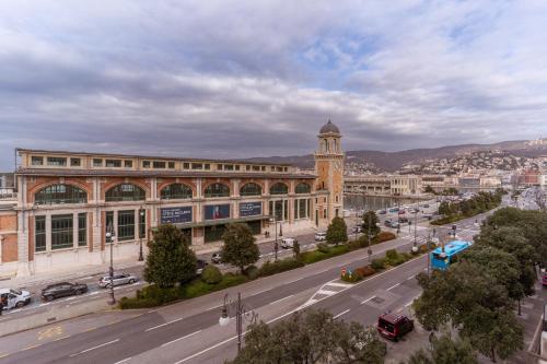 a large building with a clock tower in a city at Residence Al Granzo in Trieste