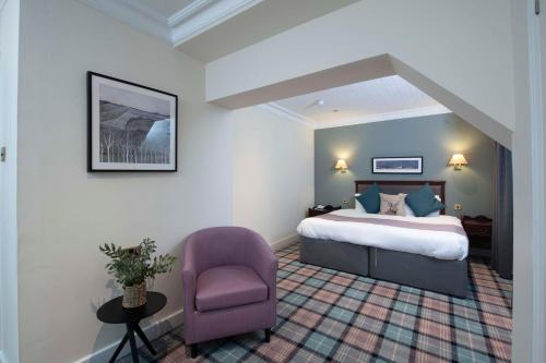 Ein Bett oder Betten in einem Zimmer der Unterkunft The Royal George Hotel