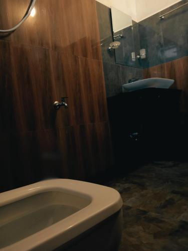 a bathroom with a tub and a toilet and a sink at Cloud Nine in Kandy