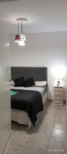 Postel nebo postele na pokoji v ubytování Sencillo PH céntrico de Marcela sin garage sin cargos