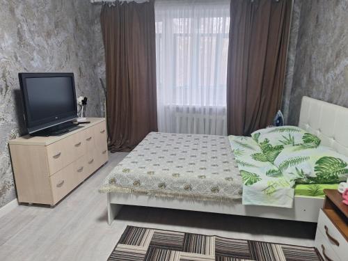 Postel nebo postele na pokoji v ubytování Машхур Жусупа 25