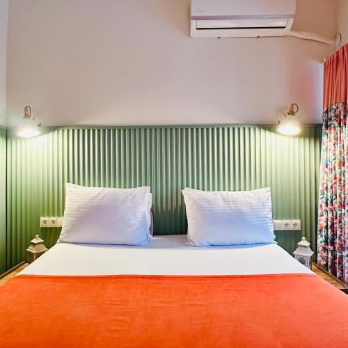 Ένα ή περισσότερα κρεβάτια σε δωμάτιο στο Casa Rosa Suites