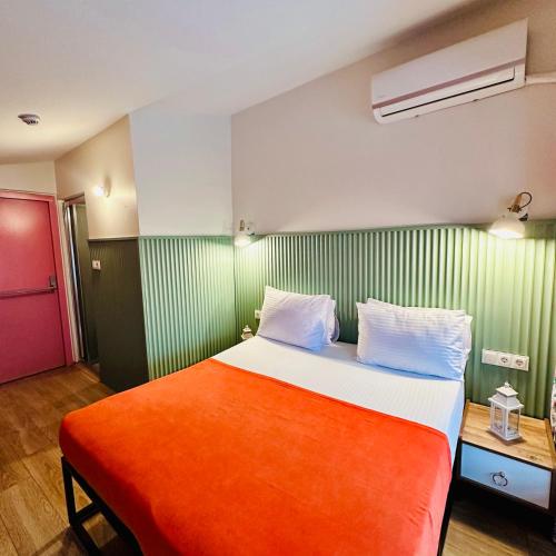 Ένα ή περισσότερα κρεβάτια σε δωμάτιο στο Casa Rosa Suites