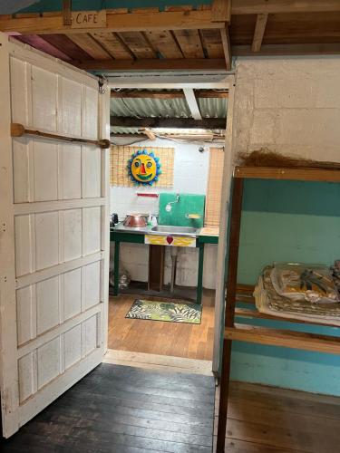 a small room with a desk and a bunk bed at Maison Paradis -Taketomi Island- メゾンパラディ竹富島 in Taketomi