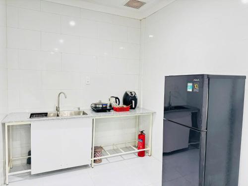 Kuchyň nebo kuchyňský kout v ubytování Căn Hộ Dương Đông town Hotel
