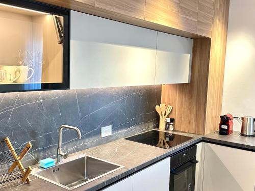a kitchen with a sink and a counter top at 4FriendsBrasov K34 in Braşov