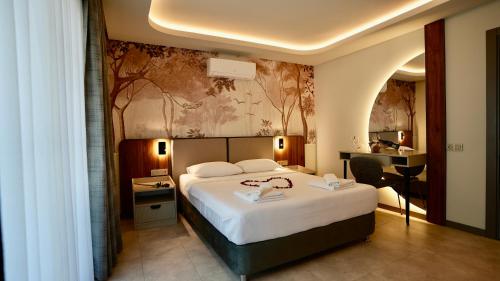 Кровать или кровати в номере Ida Hotel
