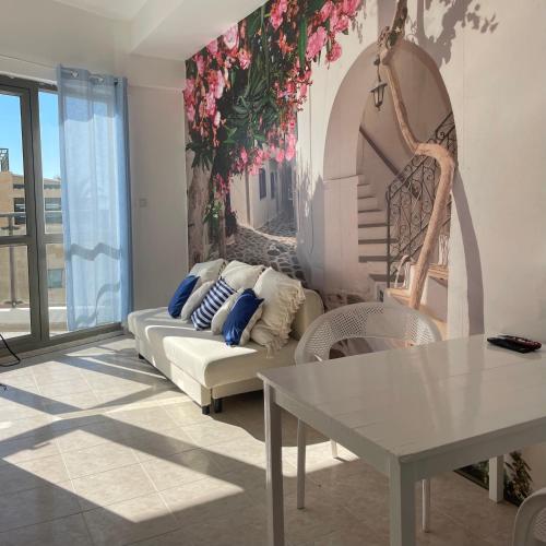 a living room with a couch and a table at SeaSun in Ashqelon