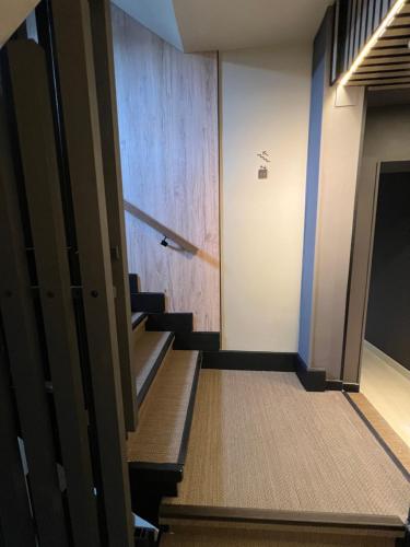 an empty hallway with stairs in a building at Apartamentos Las Vegas in Ribadesella