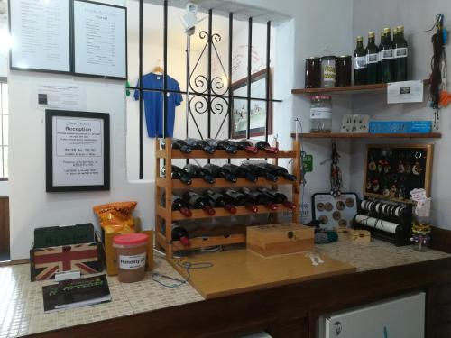 a room with a rack of wine bottles at Olive Branch El Chorro in El Chorro