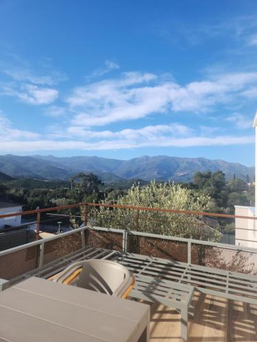 a balcony with a view of the mountains at E casette in Oletta