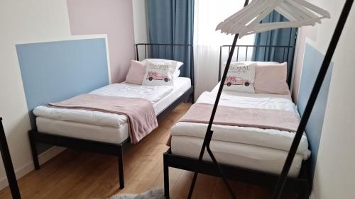 a room with two bunk beds and a mirror at La Casa in Piotrków Trybunalski