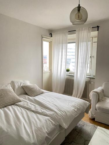 Ένα ή περισσότερα κρεβάτια σε δωμάτιο στο Central Chic Apartment in Central Stockholm