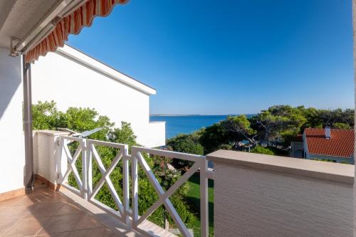 a balcony with a view of the ocean at Villa Eugenia in Košljun