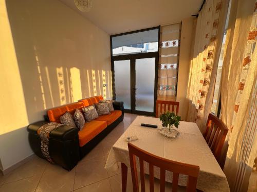 a living room with a couch and a table at Ion Sea View in Ksamil