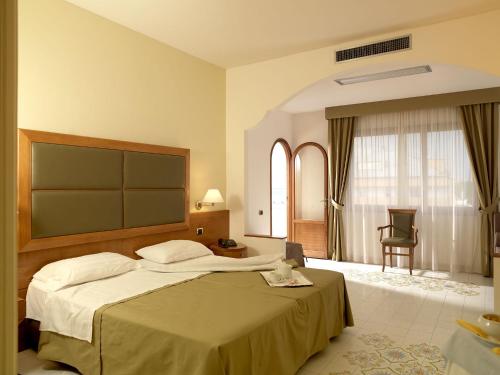 Кровать или кровати в номере Grand Hotel Don Juan