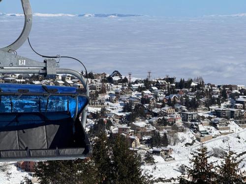 a gondola ride over a city in the snow at Winterfell Apartment Popova Shapka in Popova Shapka