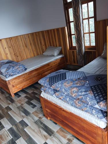 a bedroom with two beds in a room at Payun Homestay in Mirik
