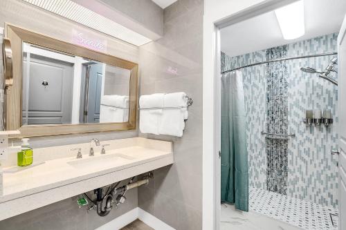 a bathroom with a sink and a shower at Disney Accessibility Star Wars Vacation Apartment Near Parks in Orlando