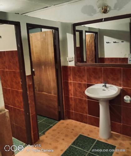 a bathroom with a sink and a mirror at Big Family Bungalow Near Swiming Pool in Ko Chang