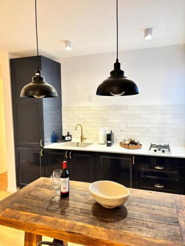 a kitchen with a wooden table with a bowl on it at Bright & sweet unit in the heart of Polanco. in Mexico City