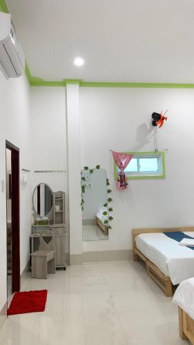 Postel nebo postele na pokoji v ubytování Homestay Châu Triều - Phan Thiết