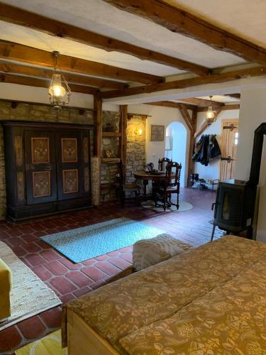 a living room with a fireplace and a dining room at Sokograd Royal in Šipovo