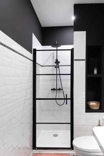 a bathroom with a shower and a toilet and a sink at Le Domaine de Villespy in Villespy