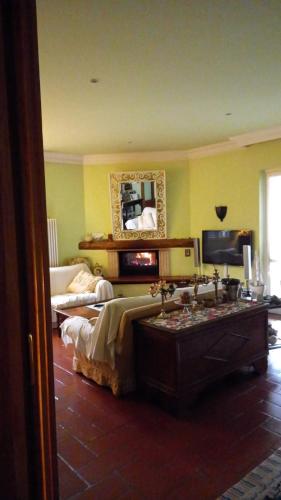 a bedroom with a bed and a tv in a room at Villa Mary in Venegono Superiore