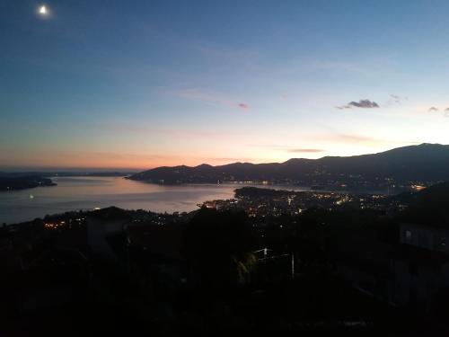 a view of a body of water at sunset at Casa Casey in Arizzano