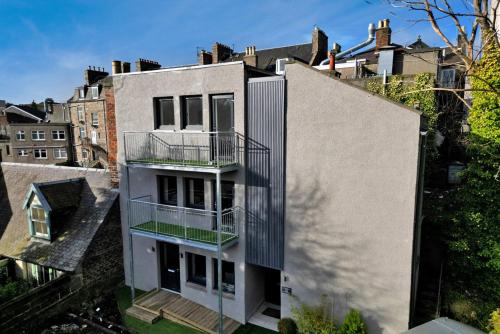 a building with a balcony on the side of it at Ash Residence City Centre in Aberdeen