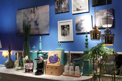 a blue room with a counter with items on it at Mini Hotel Causeway Bay in Hong Kong