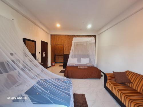 Ένα ή περισσότερα κρεβάτια σε δωμάτιο στο Ella Odyssey Inn