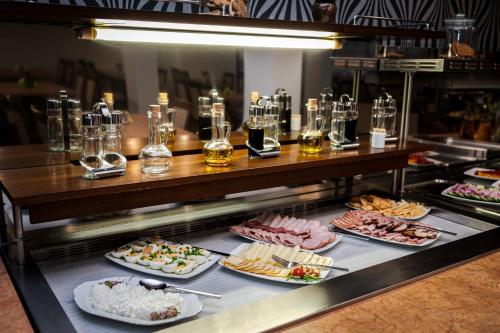 a buffet line with many different types of food at Hotel Muszyna in Muszyna